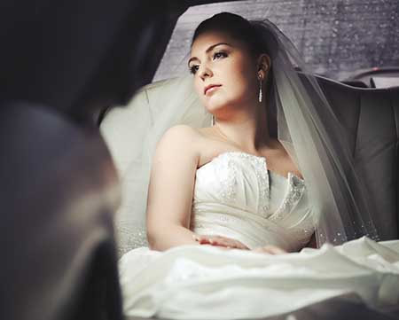 A wedding bride inside the wedding limo